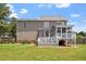 Spacious backyard featuring a large deck and screened in porch. The perfect space for outdoor entertaining! at 44 Clarke Ct, Angier, NC 27592
