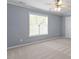 Bright bedroom with neutral carpet, fan and natural light from large window at 44 Clarke Ct, Angier, NC 27592