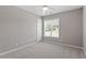 Comfortable bedroom featuring plush carpeting, natural light and neutral color at 44 Clarke Ct, Angier, NC 27592