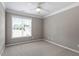Bedroom with plush carpet and lots of natural light from large window at 44 Clarke Ct, Angier, NC 27592