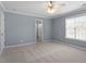 Spacious bedroom with neutral carpet and natural light, adjacent to bathroom at 44 Clarke Ct, Angier, NC 27592