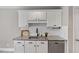 Elegant kitchen with granite countertops, white cabinets, and stainless steel dishwasher at 44 Clarke Ct, Angier, NC 27592