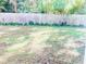 Backyard features a spacious lawn, providing ample space for recreation and gardening at 4418 Roller Ct, Raleigh, NC 27604