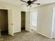 Spacious bedroom with a ceiling fan and large closets at 4418 Roller Ct, Raleigh, NC 27604