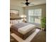 Comfortable bedroom featuring a wooden bed frame and natural light from a nearby window at 4418 Roller Ct, Raleigh, NC 27604