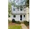 Charming gray townhome with a well-maintained front yard and inviting entrance at 4418 Roller Ct, Raleigh, NC 27604
