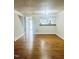 Bright living area with hardwood floors and an open view to the kitchen at 4418 Roller Ct, Raleigh, NC 27604