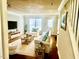 Cozy living room with hardwood floors, comfortable seating, and natural light at 4418 Roller Ct, Raleigh, NC 27604