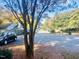 Quiet neighborhood street with mature trees, offering a peaceful and scenic environment at 4418 Roller Ct, Raleigh, NC 27604
