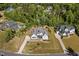 Aerial view of a beautifully landscaped home, showcasing its lush surroundings and neighborhood at 623 Westfall Way, Chapel Hill, NC 27517
