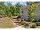 Well-maintained backyard featuring stepping stones, lush greenery and mulch at 623 Westfall Way, Chapel Hill, NC 27517