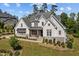 Attractive house with a gray roof, stone accents, complemented by a front yard with beautiful landscaping at 623 Westfall Way, Chapel Hill, NC 27517