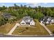 Expansive home with gray roof, stone accents, beautifully landscaped yard and long driveway leading to a garage at 623 Westfall Way, Chapel Hill, NC 27517