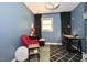 Bedroom features blue walls, a window, and a cozy chair at 6308 Rolling Acres Drive, Gibsonville, NC 27249