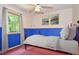Bedroom featuring a large window, light colored walls and a white bed spread at 6308 Rolling Acres Drive, Gibsonville, NC 27249
