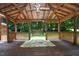 Gazebo with wood flooring and a swing at 6308 Rolling Acres Drive, Gibsonville, NC 27249