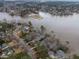 Scenic aerial view showcases the lakefront homes and natural beauty of the surrounding landscape at 651 Sagamore Dr, Louisburg, NC 27549