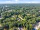 This aerial view shows homes surrounded by lush greenery, highlighting the community's serene environment at 7020 Longstreet Dr # A, Raleigh, NC 27615