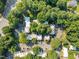 Aerial view of the community showcasing lush greenery, ample parking, and well-maintained buildings at 7020 Longstreet Dr # A, Raleigh, NC 27615