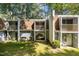 Townhome backyard with a grassy lawn and a private patio area, surrounded by mature trees for privacy at 7020 Longstreet Dr # A, Raleigh, NC 27615