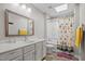 Bright bathroom featuring a double sink vanity, and a shower/tub combo with playful animal-themed curtains at 7020 Longstreet Dr # A, Raleigh, NC 27615