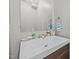 Bathroom featuring a single sink vanity and a mirror at 7020 Longstreet Dr # A, Raleigh, NC 27615