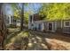 Charming two-story townhouse with a well-maintained lawn and beautiful surrounding trees at 7020 Longstreet Dr # A, Raleigh, NC 27615