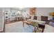 Comfortable living room featuring a sofa, marble coffee table, and a view of the breakfast area and kitchen at 7020 Longstreet Dr # A, Raleigh, NC 27615