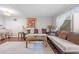 Inviting living room with a sofa, marble coffee table, and a view of the back patio at 7020 Longstreet Dr # A, Raleigh, NC 27615