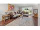 Inviting living room with comfortable seating, hardwood floors, and a view of the outdoors at 7020 Longstreet Dr # A, Raleigh, NC 27615