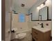 Bathroom with vanity, square mirror, and a shower/tub combo at 719 E Whitaker Mill Rd, Raleigh, NC 27608