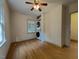 Bedroom with hardwood floors and natural light featuring a washer and dryer at 719 E Whitaker Mill Rd, Raleigh, NC 27608