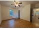 Cozy bedroom featuring hardwood floors and a window overlooking the backyard at 719 E Whitaker Mill Rd, Raleigh, NC 27608