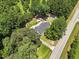 Overhead view showing the house surrounded by mature trees and convenient access to the road at 7722 Nc 27, Lillington, NC 27546