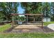 Outdoor space featuring a wooden pergola structure and fenced in backyard, ideal for gatherings or relaxing outdoors at 7722 Nc 27, Lillington, NC 27546