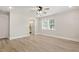 Spacious bedroom with a ceiling fan, natural light, and ensuite bathroom access at 7722 Nc 27, Lillington, NC 27546
