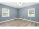 Bedroom featuring dual windows offering plenty of light and a ceiling fan at 7722 Nc 27, Lillington, NC 27546