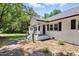 Charming white brick home with black shutters and welcoming front porch, great curb appeal at 7722 Nc 27, Lillington, NC 27546