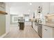 Newly remodeled kitchen boasts stainless appliances, granite countertops, and an island with seating at 7722 Nc 27, Lillington, NC 27546