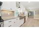 Updated kitchen features stainless steel appliances, granite countertops and a farmhouse sink at 7722 Nc 27, Lillington, NC 27546
