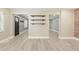 Bright living room with modern wood shelves, neutral paint, and lots of natural light at 7722 Nc 27, Lillington, NC 27546