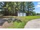 View of an outbuilding with roll-up doors, offering additional storage at 7722 Nc 27, Lillington, NC 27546