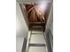 A pull-down ladder leads to attic storage, with wooden beams visible above at 8836 Thornton Garden Ln, Raleigh, NC 27616