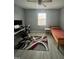 Bedroom featuring ceiling fan, desk area, area rug, and a twin-size bed at 8836 Thornton Garden Ln, Raleigh, NC 27616