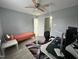 Bright bedroom with ceiling fan and desk. Perfect for work or study at 8836 Thornton Garden Ln, Raleigh, NC 27616