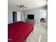 Large bedroom with laminate floors, walk-in closet, and modern dresser at 8836 Thornton Garden Ln, Raleigh, NC 27616