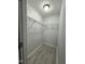 Walk-in closet featuring neutral paint, wooden floors, and storage shelving at 8836 Thornton Garden Ln, Raleigh, NC 27616