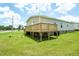 New back deck is perfect for outdoor gatherings and enjoying the landscape at 100 Cottonwood Ct, Kenly, NC 27542
