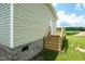 Back door access to a large new wooden deck with an expansive yard at 100 Cottonwood Ct, Kenly, NC 27542