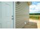 Close-up of the back door with access to the wooden deck, offering great outdoor living at 100 Cottonwood Ct, Kenly, NC 27542